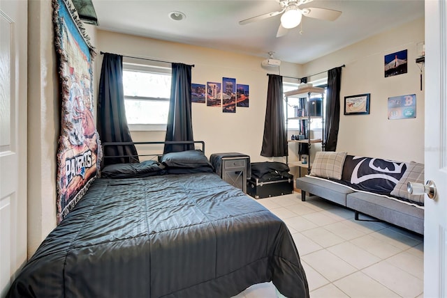 bedroom featuring light tile patterned floors and ceiling fan