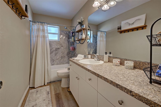 full bathroom with wood-type flooring, vanity, toilet, and shower / bath combo