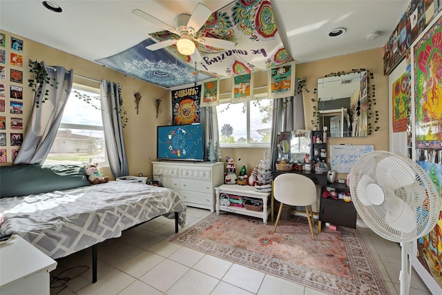 bedroom featuring tile patterned floors and ceiling fan