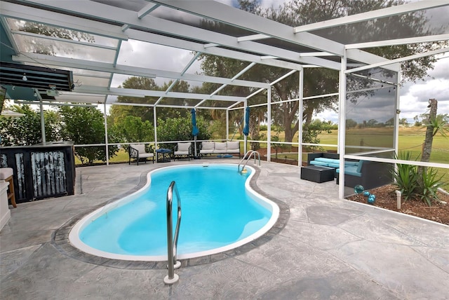 view of pool with an outdoor living space, a patio area, and glass enclosure