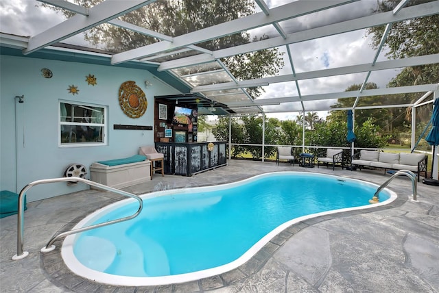 view of pool featuring a lanai and a patio area