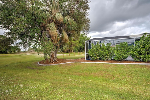 view of yard with a lanai