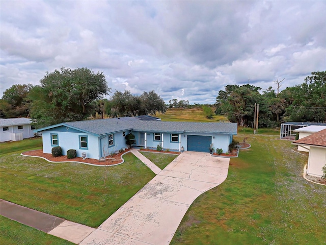 ranch-style house with a garage and a front lawn