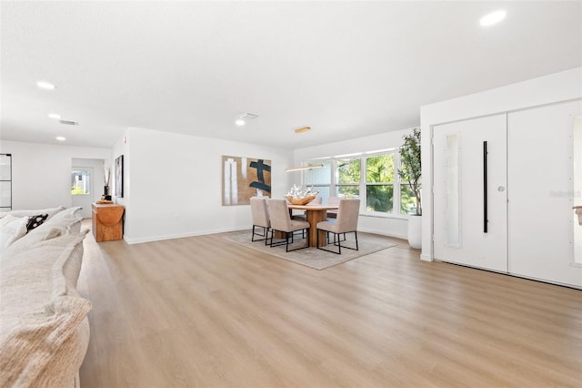 dining space with light wood-type flooring