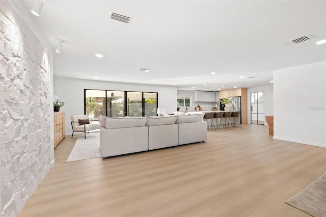 living room with light hardwood / wood-style floors