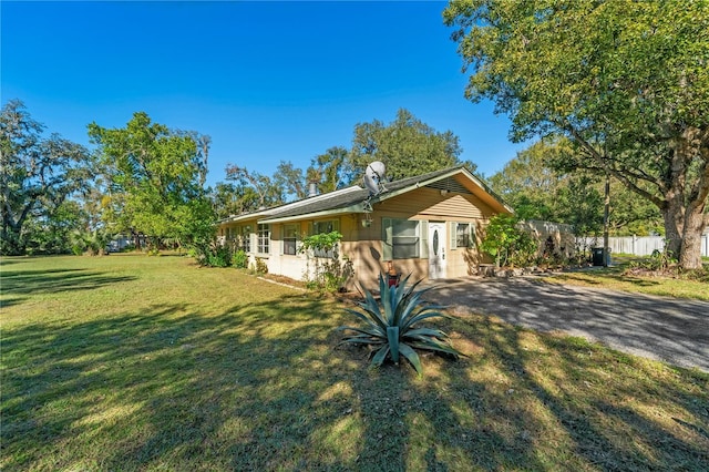 view of side of property featuring a lawn