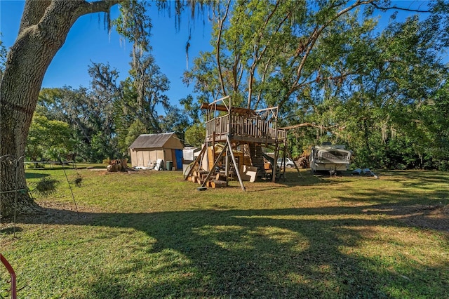 view of jungle gym with a storage unit and a lawn