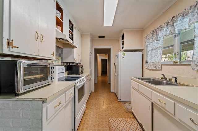 kitchen featuring white appliances, white cabinetry, crown molding, and sink