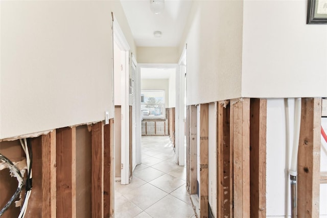 hall with light tile patterned flooring