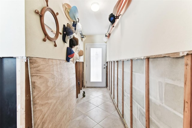 hallway with light tile patterned floors