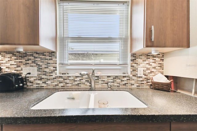 kitchen with decorative backsplash and sink