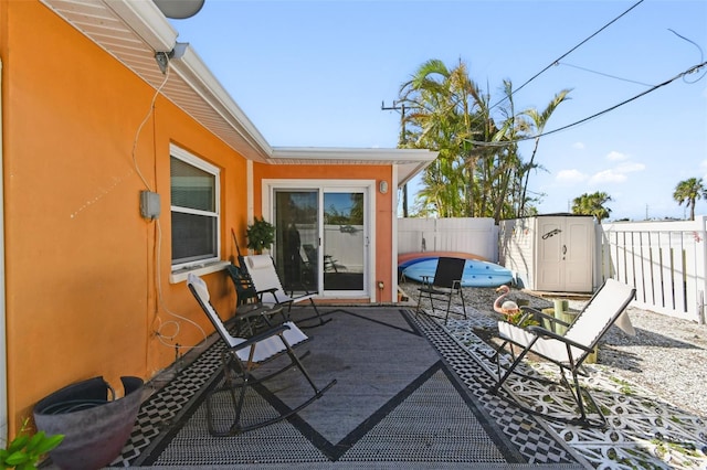 view of patio / terrace with a storage unit