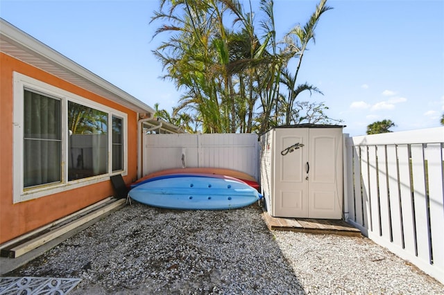 view of yard featuring a baseboard radiator and a storage unit