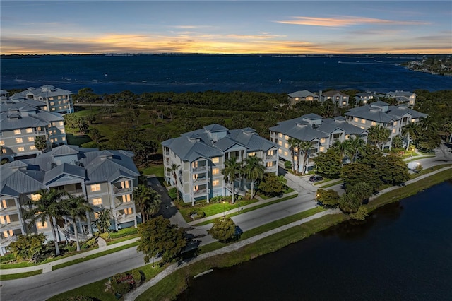 aerial view at dusk with a water view