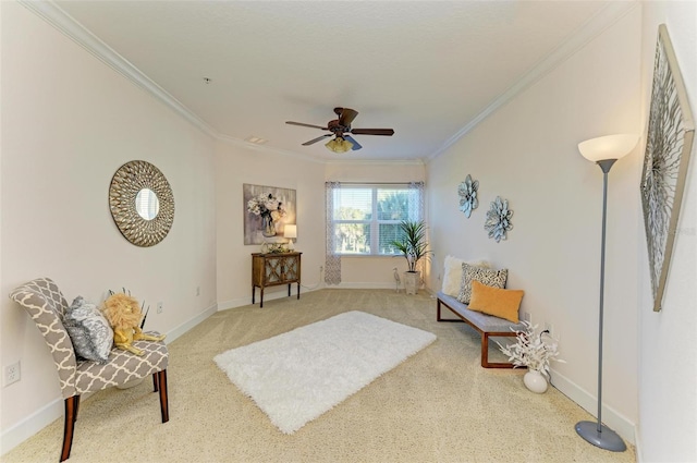 living area with carpet, ceiling fan, and crown molding