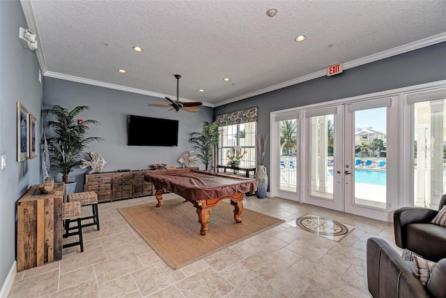 game room featuring french doors, ornamental molding, a healthy amount of sunlight, and billiards