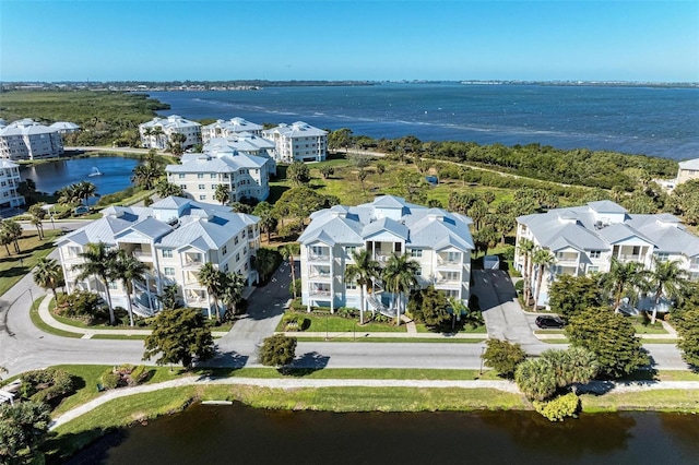 drone / aerial view with a water view