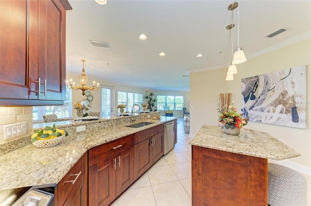 kitchen with hanging light fixtures, sink, stainless steel dishwasher, and ornamental molding