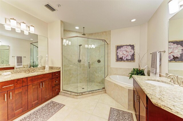 bathroom featuring tile patterned floors, vanity, and plus walk in shower