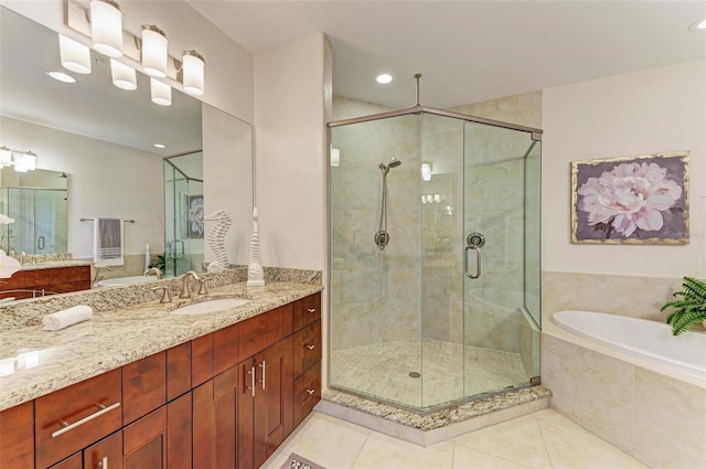 bathroom featuring vanity, tile patterned floors, and independent shower and bath