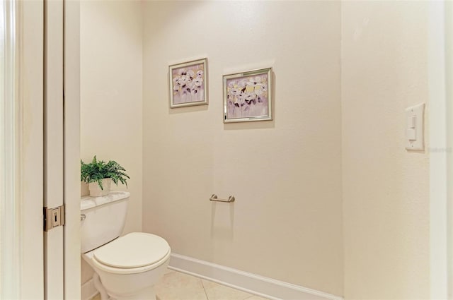 bathroom featuring tile patterned floors and toilet