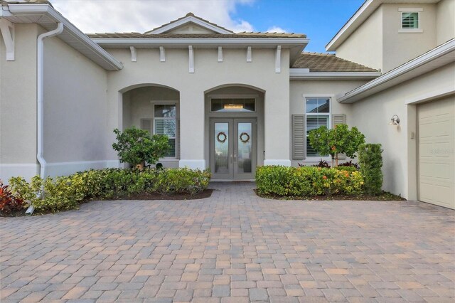 doorway to property featuring french doors