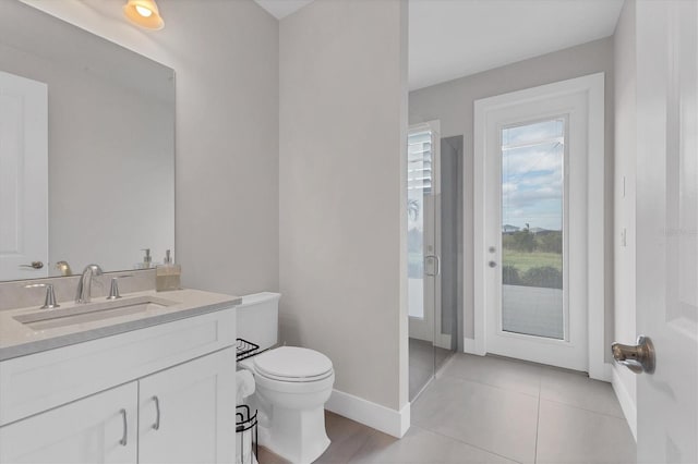 bathroom with tile patterned floors, vanity, and toilet