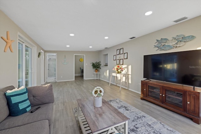 living room with light hardwood / wood-style flooring