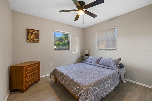 bedroom featuring ceiling fan and hardwood / wood-style flooring