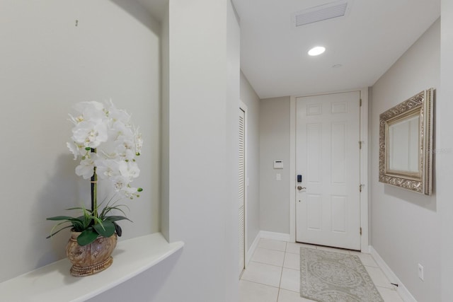 doorway featuring light tile patterned floors