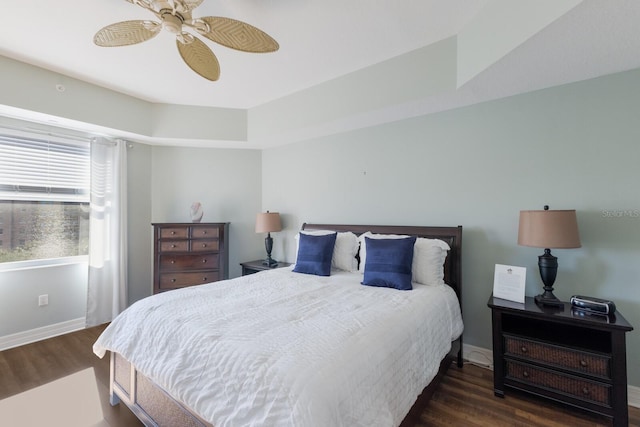 bedroom featuring dark hardwood / wood-style flooring and ceiling fan