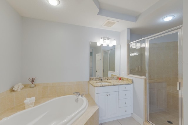 bathroom with tile patterned floors, vanity, and plus walk in shower