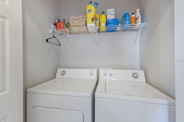 laundry area with washing machine and clothes dryer