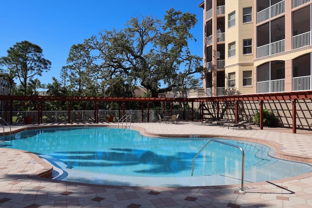 view of swimming pool featuring a patio area