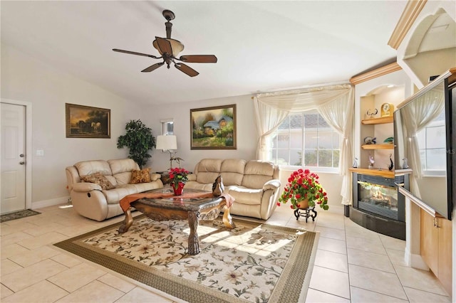 living room featuring ceiling fan, light tile patterned floors, and lofted ceiling