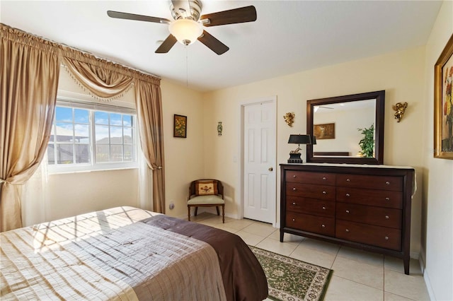 bedroom featuring ceiling fan and light tile patterned floors