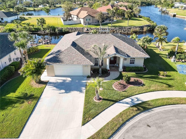 view of front facade featuring a water view and a garage