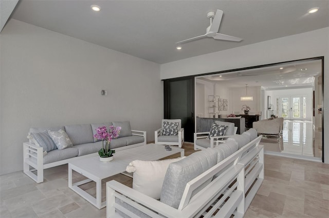 living room with french doors and ceiling fan