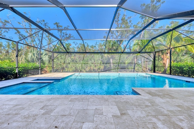 view of swimming pool with a lanai and a patio