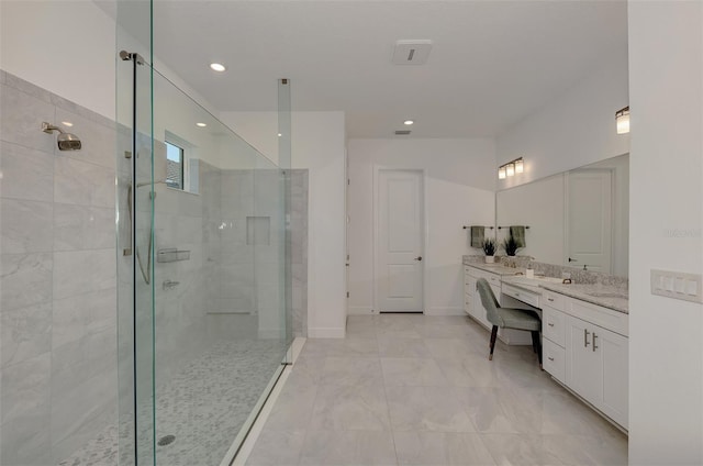 bathroom with vanity and an enclosed shower