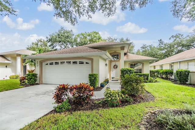 view of front of house featuring a garage and a front lawn