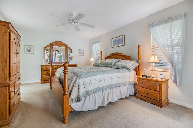 bedroom featuring ceiling fan and light colored carpet