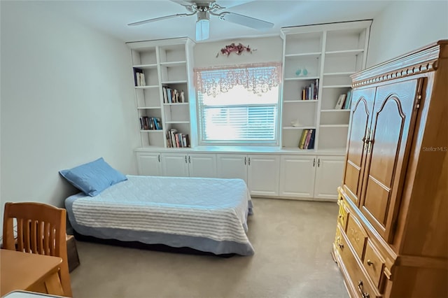 bedroom with ceiling fan and light colored carpet