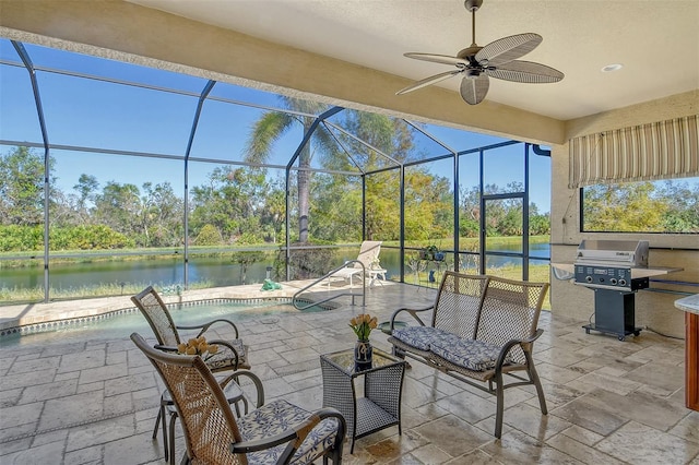 view of patio / terrace with glass enclosure, a water view, area for grilling, and ceiling fan