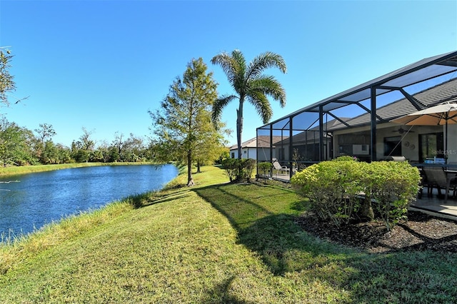 view of yard featuring a water view and a lanai