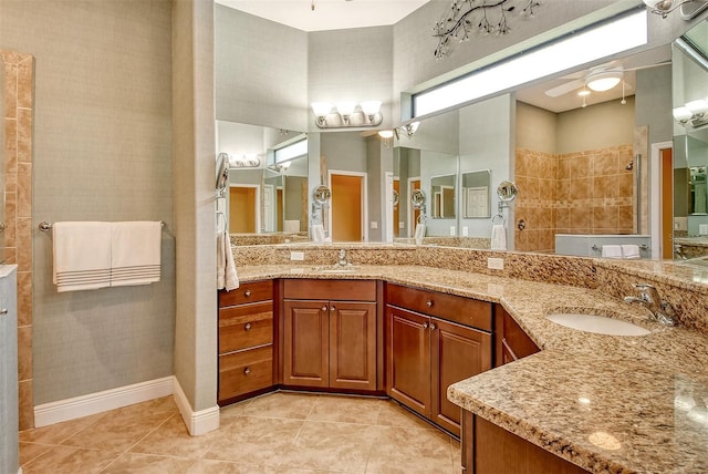 bathroom featuring tile patterned floors, a shower, vanity, and ceiling fan