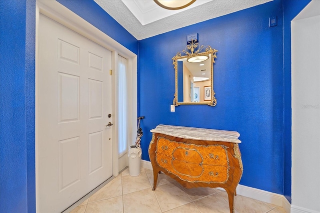 entrance foyer featuring tile patterned flooring and a textured ceiling