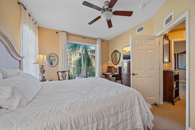 bedroom featuring lofted ceiling, ceiling fan, access to exterior, a textured ceiling, and light colored carpet