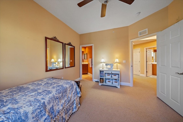 carpeted bedroom with ceiling fan and ensuite bathroom