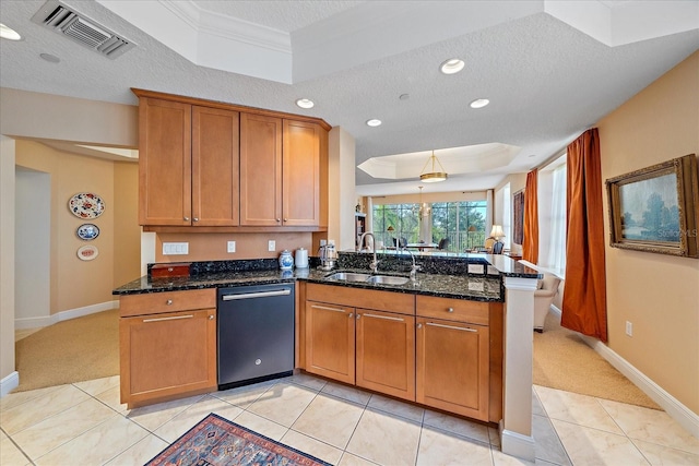 kitchen featuring kitchen peninsula, dishwasher, sink, and a textured ceiling